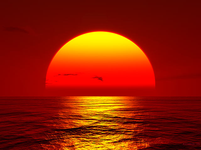 sunset big orange sun setting over ocean